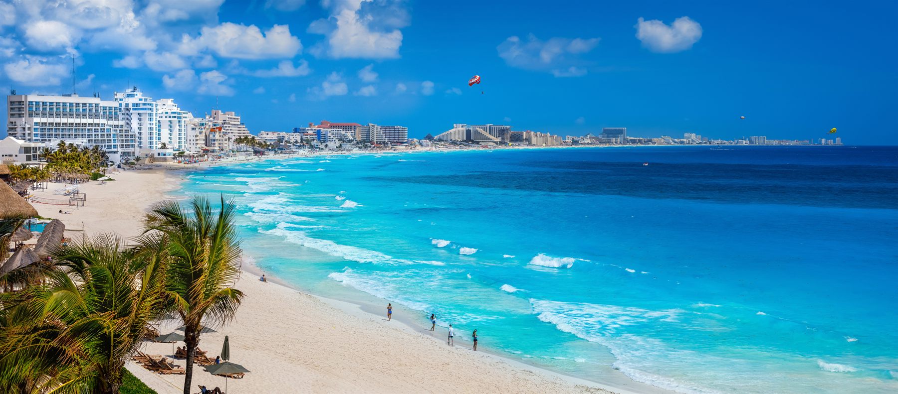 Turquoise water and a hotel-lined beach in Cancún, Mexico
